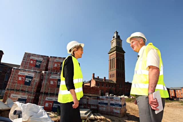 Hilary Harman and Seamus Neville, owner of development company WN Developments, pictured at the site back in 2012 when the firm first announced plans to build "luxury appartments" there.