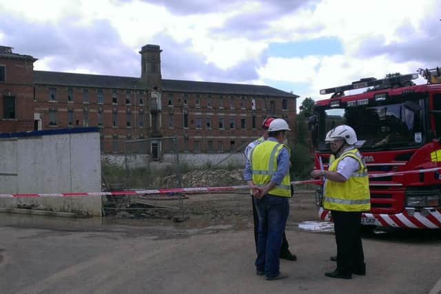 Fire and police investigators prepare to examine the St Crispin's hospital site back in August 2014. Finally plans have been submitted to convert the buildings into homes.