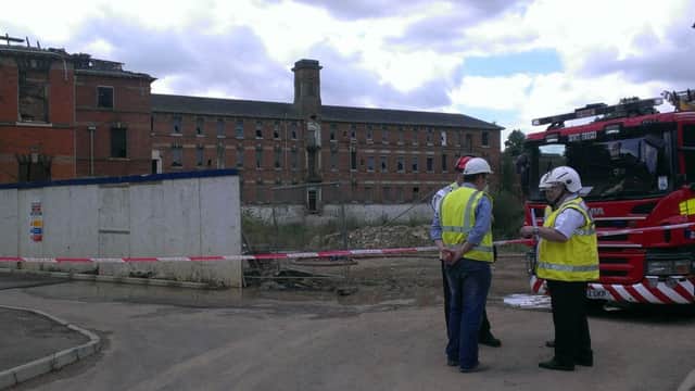 Fire and police investigators prepare to examine the St Crispin's hospital site back in August 2014. Finally plans have been submitted to convert the buildings into homes.