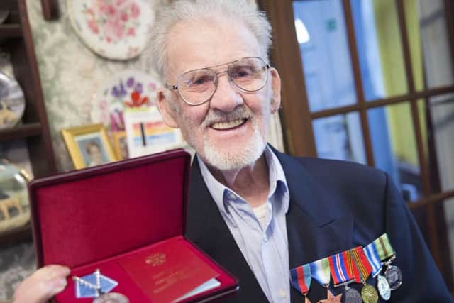 WWII vet Kenneth Swann was presented with a medal by the Russian ambassador who turned up at his door in Northampton. NNL-160127-114930009