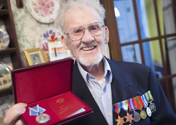 WWII vet Kenneth Swann was presented with a medal by the Russian ambassador who turned up at his door in Northampton. NNL-160127-114930009