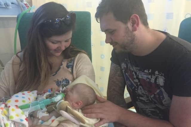 Zachary with his parents Lauren Coulson and Darryl Winfield