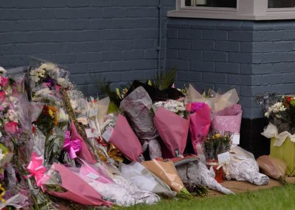 GV of floral tributes left outside The Collingtree pub where India Chipchase worked.