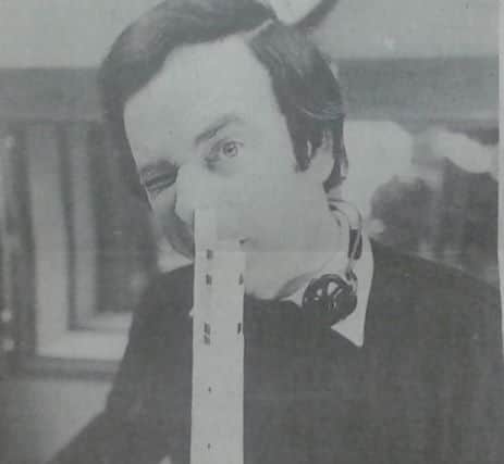 Terry Wogan 'poses' with a model of the lift tower delivered to him by a Chron reporter