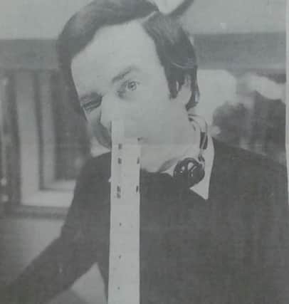 Terry Wogan 'poses' with a model of the lift tower delivered to him by a Chron reporter