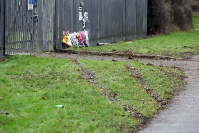 Flowers left at the scene of the collision.