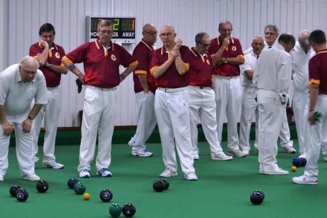 WEIGHING UP THE OPTIONS - action from Northants Over-60s' win over Suffolk
