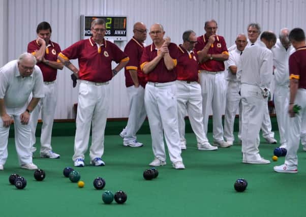 WEIGHING UP THE OPTIONS - action from Northants Over-60s' win over Suffolk