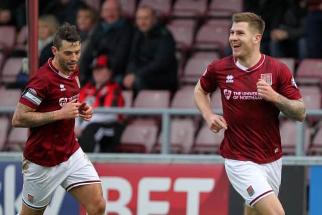 James Collins celebrates after giving Cobblers the lead against Morecambe in their last outing two weeks ago