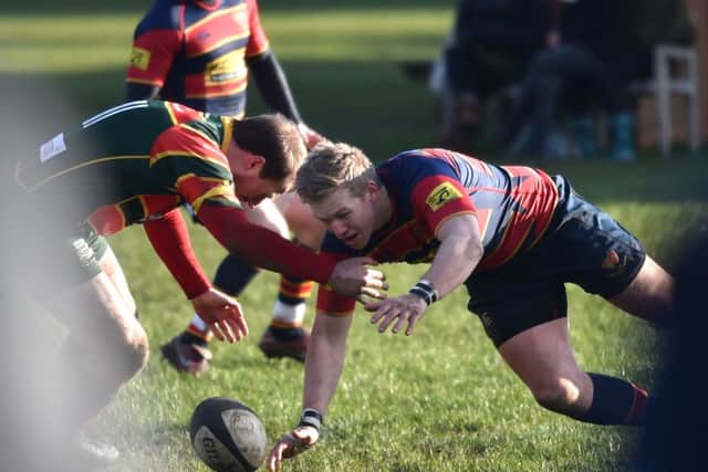 BATTLING FOR POSSESSION - action from ONs' narrow defeat to Sandbach
