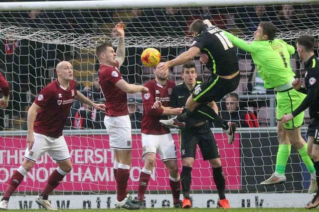 IN THE THICK OF THE ACTION - Ryan Cresswell (left) was delighted to be back in the Cobblers team on Saturday (Picture: Sharon Lucey)