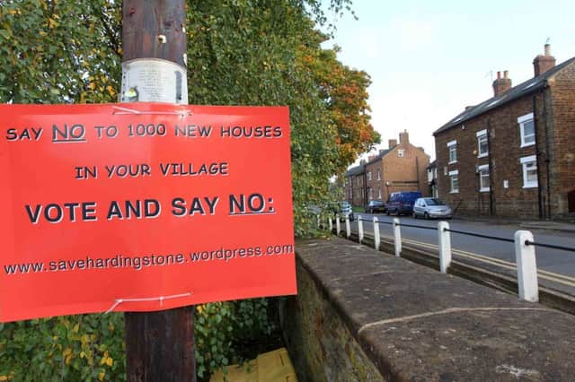 Posters in Hardingstone village to protest about the proposed 1000 new houses.