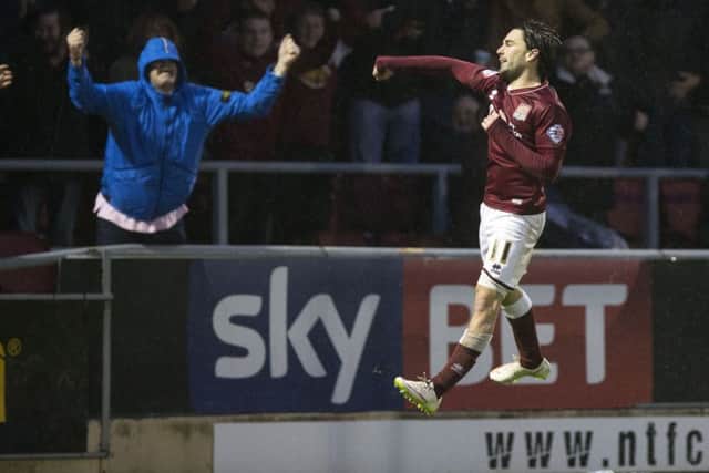 JUMPING FOR JOY - Ricky Holmes celebrates his goal in the 3-0 win over Barnet on January 2