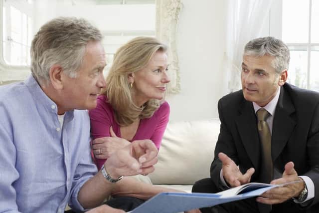 Retirees speaking with their financial advisor. Pic by Shutterstock