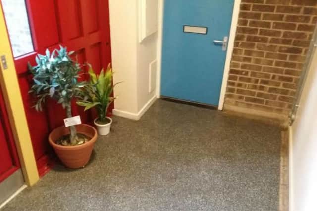 A plant placed outside a resident's door has been demed a fire risk by Northmapton Partnership Homes