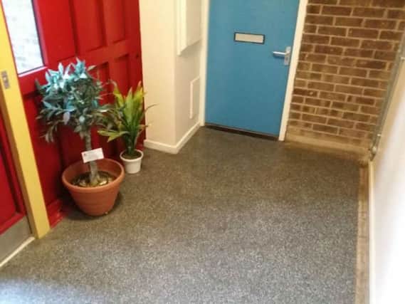 A plant placed outside a resident's door has been demed a fire risk by Northmapton Partnership Homes