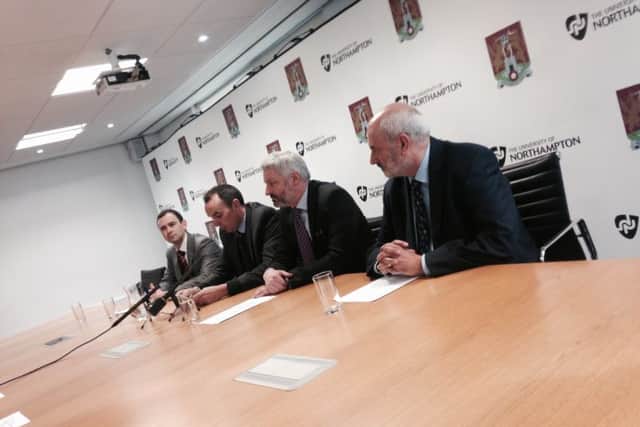 Northampton Town chairman Kelvin Thomas and vice chancellor of the University of Northampton Nick Petford, announce the extension to their 'partnership' today. Far left is Cobblers chairman James Whiting and far right is chief operating officer of the university Terry Neville.