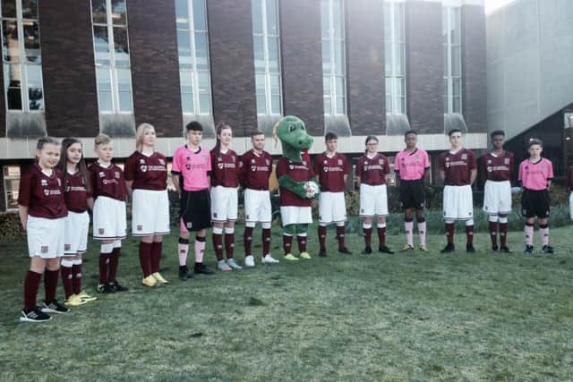 Representatives from every Northampton Town side, from the under nines right through to the League Two first team - here represented by winger Alfie Potter.