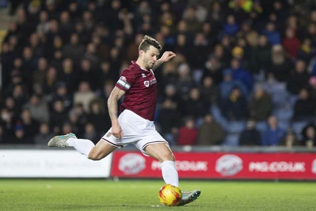 BOOM! - Marc Richards hammers home his penalty at Oxford United on Tuesday (Picture: Kirsty Edmonds)
