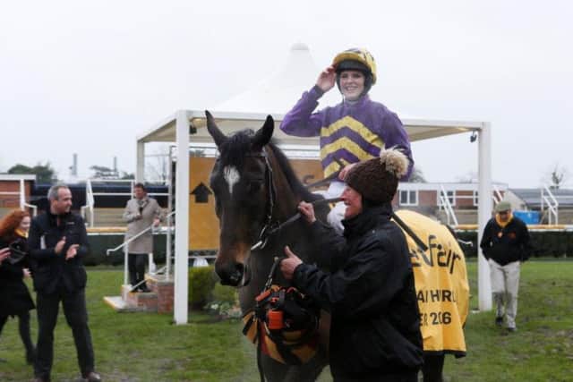 GIRL POWER - a jubilant Lizzie Kelly after the Betfair Hurdle at Newbury last Saturday but Agrapart does not hold a Festival entry and county owner Rob Rexton has high hopes for Flying Angel which finished third, on better ground (Picture courtesy of www.gjmultimedia.co.uk)