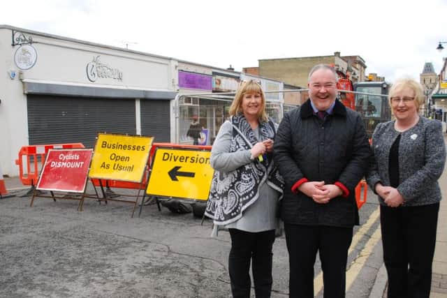 Councillor Mary Markham with Annie Rockley from Peppertrees and Jonathan Williams from Montague Jeffrey on St Giles Street