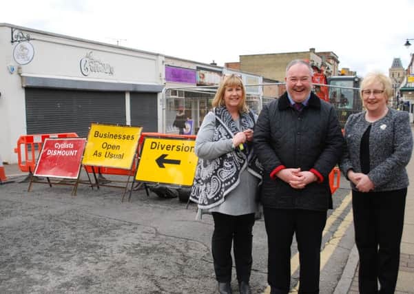Councillor Mary Markham with Annie Rockley from Peppertrees and Jonathan Williams from Montague Jeffrey on St Giles Street