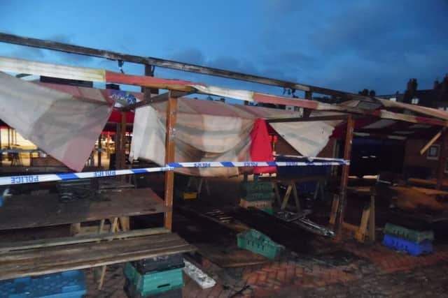 Police seal off stalls at Northampton market. Picture by Eamonn Fitzpatrick NNL-160223-085628001