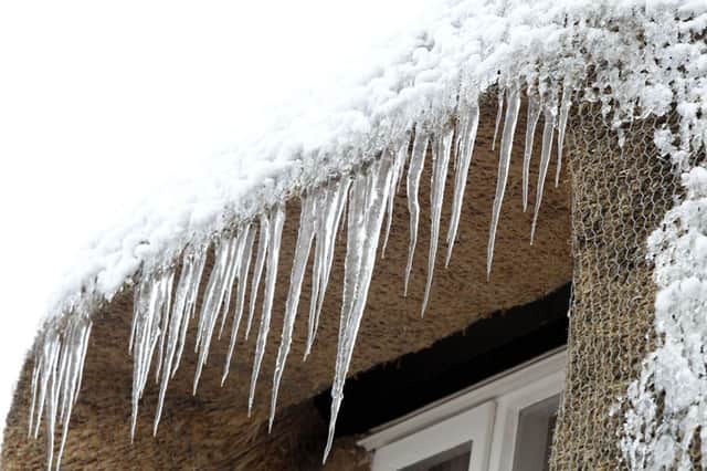 Icicles on the thatch of a cottage in Main Street, Little Harrowden