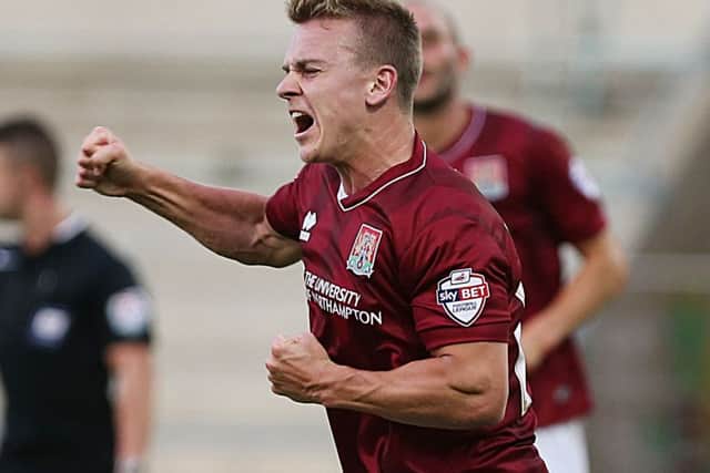 Cobblers striker Sam Hoskins has signed a contract to stay at Sixfields until the summer of 2018