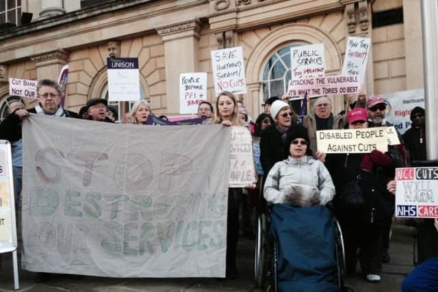 Members of the public, union members and service users protested against the planned £65m worth of cuts to the county council outside County Hall last week.