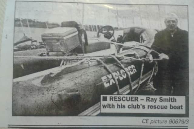 Ray Smith with the rescue boat that had aided the Easter floods rescues. The picture was published in the Chron on April 9, 1998.