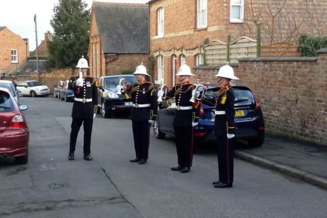 The buglers performing outside Fred Carrington's window.