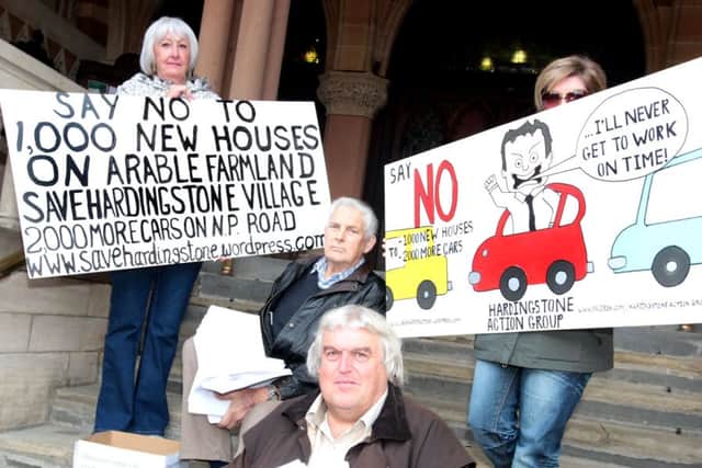 A group of residents from Hardingstone delivered  700 letters to the planning department at the Guildhall.