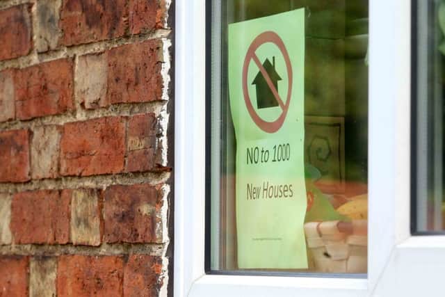 Posters in Hardingstone village to protest about the proposed 1000 new houses. ENGNNL00120131015175546
