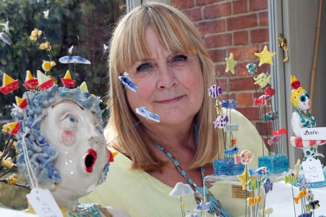 Dianne MacRae with some of her artwork