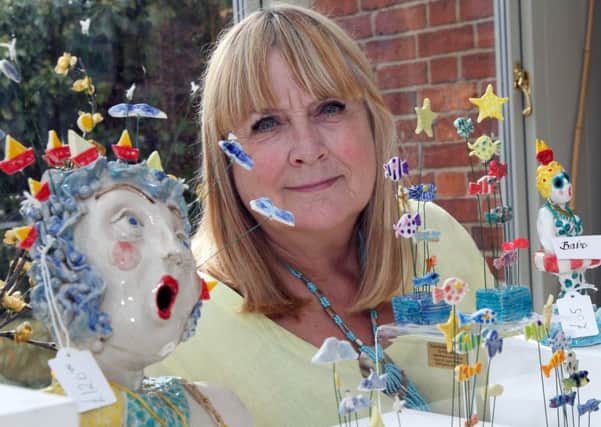 Dianne MacRae with some of her artwork