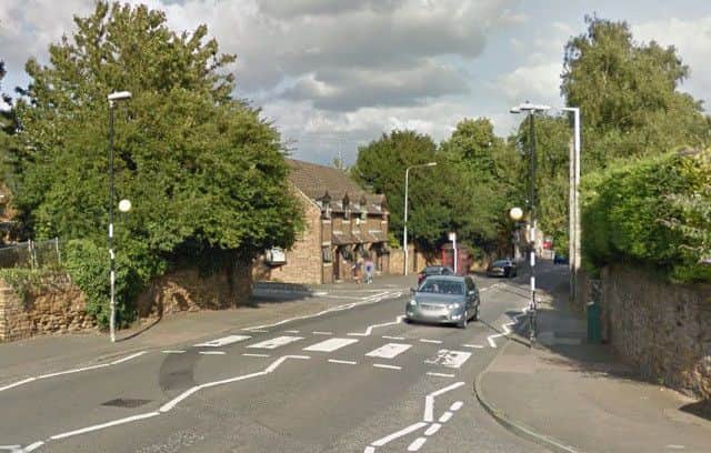 Main Road in Duston had to be closed while ambulance crews helped a man who had fallen on the zebra crossing.