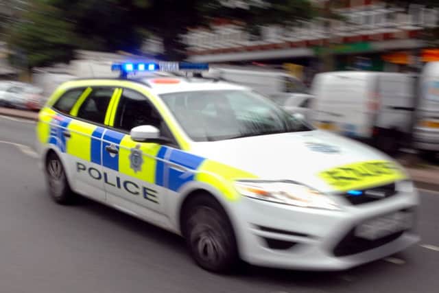 A woman was left with bruising and swelling to her head after being assaulted outside a school in Wellingborough.