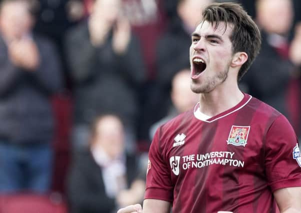 HAPPY AT SIXFIELDS - striker John Marquis celebrates his goal for the Cobblers against Cambridge United on Saturday (Pictures: Kirsty Edmonds)