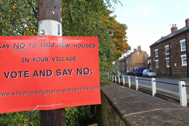 Posters in Hardingstone village protested about the proposed 1,000 new houses. But the protests amounted to nothing after the the communities secretary granted the appeal to build them.