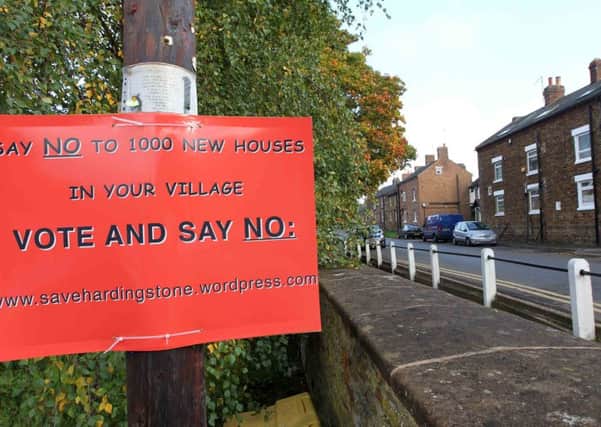 Posters in Hardingstone village protested about the proposed 1,000 new houses. But the protests amounted to nothing after the the communities secretary granted the appeal to build them.