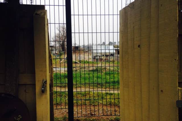 The view from one Holdenby Road residents garden shows their back gate now leads to a green security fence.