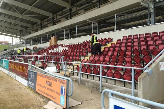 Workmen have been busy this week fitting the new seats in the east stand at Sixfields