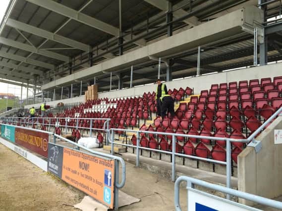 Workmen have been busy this week fitting the new seats in the east stand at Sixfields
