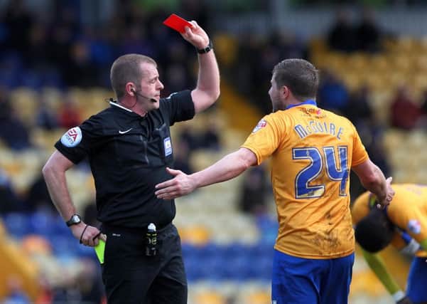 Mansfield's Jamie McGuire was sent off before the break (pictures: Sharon Lucey)