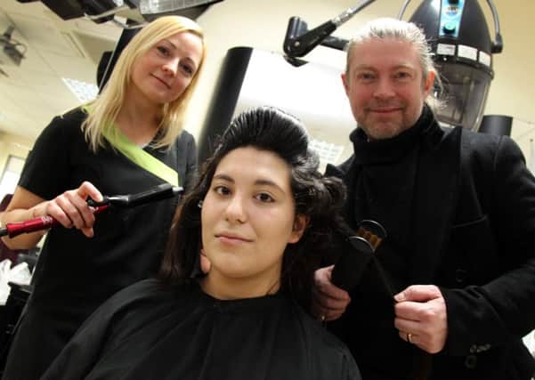 Cecilia Ventura has her hair done by Lee Stafford and Level 3 student Kristine Sloka at Tresham College in Kettering