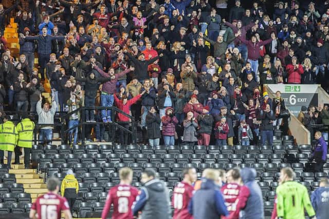 MEMORABLE DAY - the Cobblers fans enjoy their team's 2-1 win at Notts County in November. They would also soon enjoy Chris Wilder's impassioned post-match plea to David Cardoza