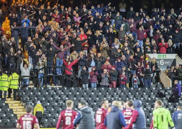 MEMORABLE DAY - the Cobblers fans enjoy their team's 2-1 win at Notts County in November. They would also soon enjoy Chris Wilder's impassioned post-match plea to David Cardoza