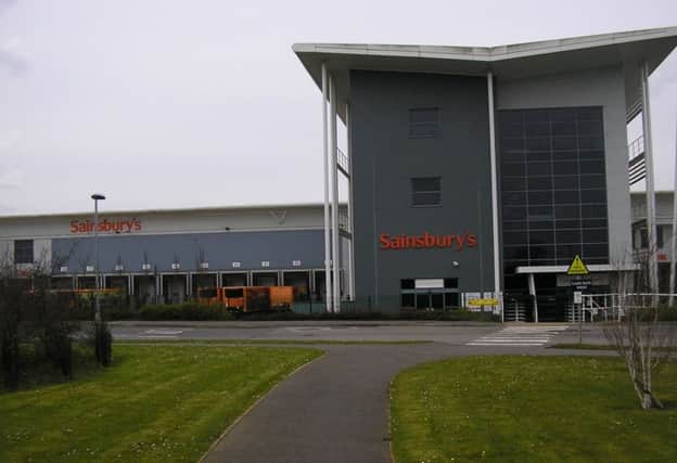 Wincanton's Sainsbury's distribution centre. The firm was so convinced an employer was faking injury to get time off work, it hired private investigators to tail her. Now it will have to pay her Â£20,000 in compensation.