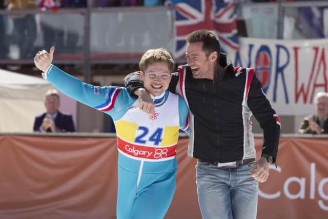 Taron Egerton and Hugh Jackman